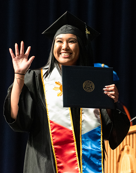 Graduate in cap and gown