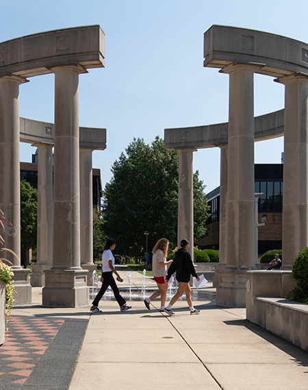 Students walk through the colonnade at the University of Illinois Springfield.