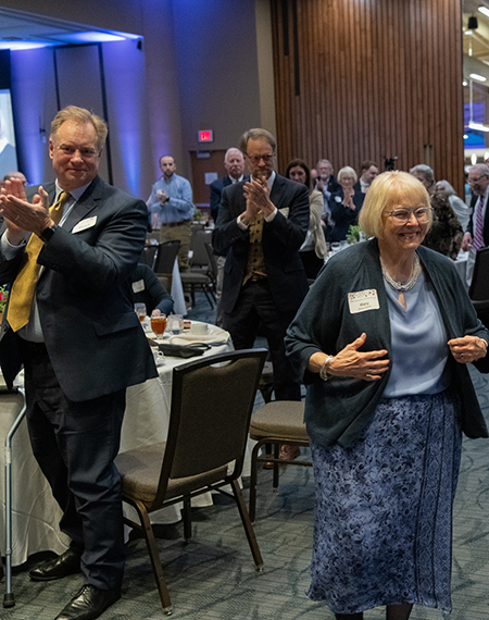 Mary Mitchell Beaumont walks to the stage to receive the 2025 William E. Winter Award.