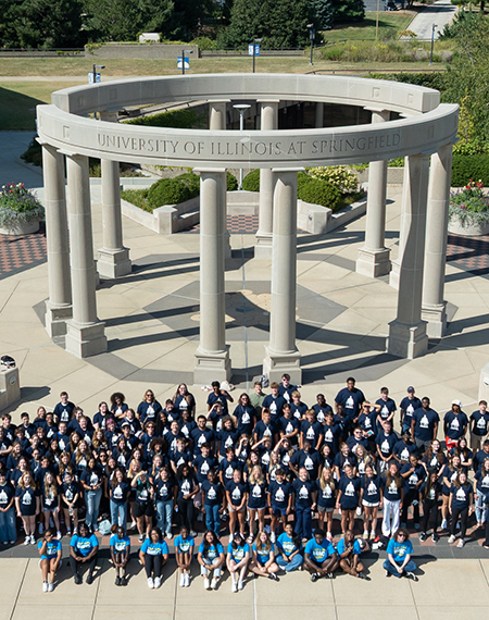 A mass group shot of the UIS Class of 2029 in front of the colonnade. 