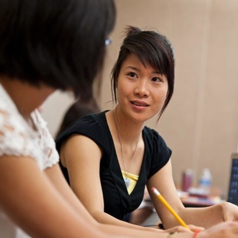 two students talking in class