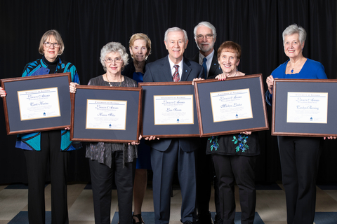 A group of alumni holding their Alumni Loyalty Awards