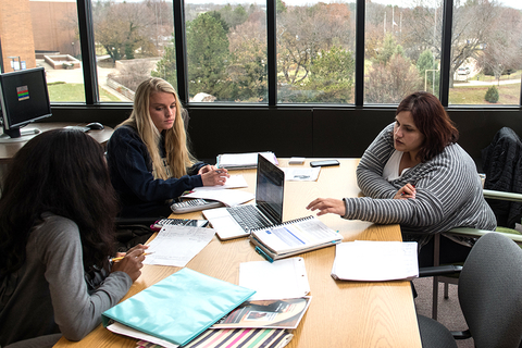 three students studying at the Learning Hub
