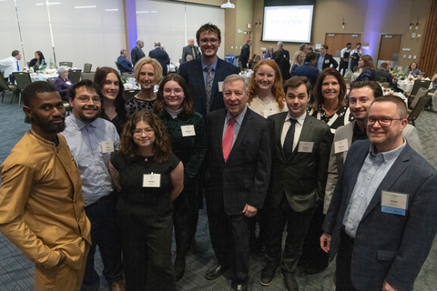 a group of PAR students post with leadership and an award recipient