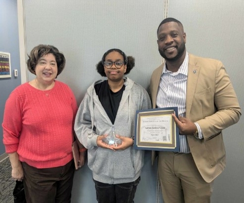 Kailynn Jackson-Green holding her award with Dr. Clark