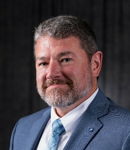 Brandon E. Schwab head-and-shoulders photo in business attire