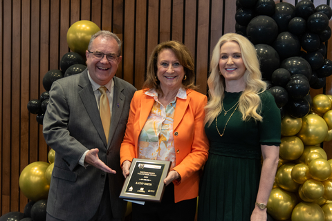 Three individuals at the Good As Gold Volunteer Awards Ceremony