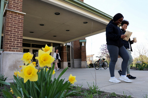 three female students walking out of UHB