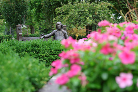 the Shakespeare statue in the background and flowers in the foreground