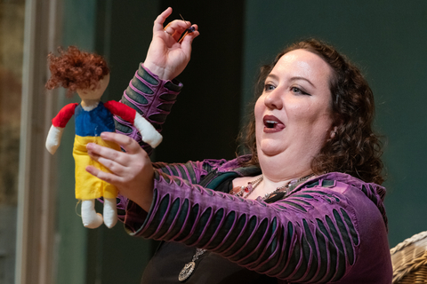 an actor sticking a pin in a voodoo doll