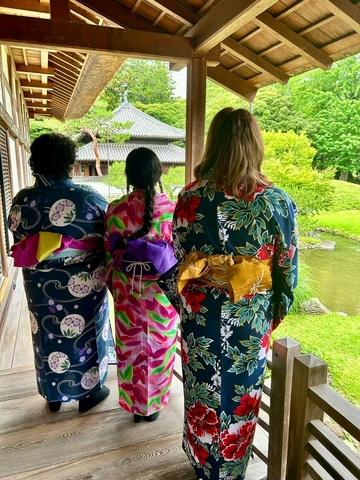 Three UIS students wearing colorful Yukatas