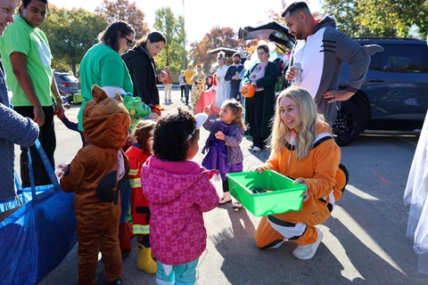 Children dressed in costume pick out candy at annual UIS Trunk or Treat