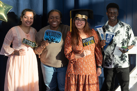 Winter grads pose at a celebration in the student union.