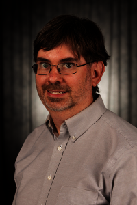 Headshot of James Nickras.