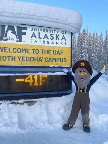 University of Fairbanks welcome sign with over a feet of snow and display temperature of -41 degrees