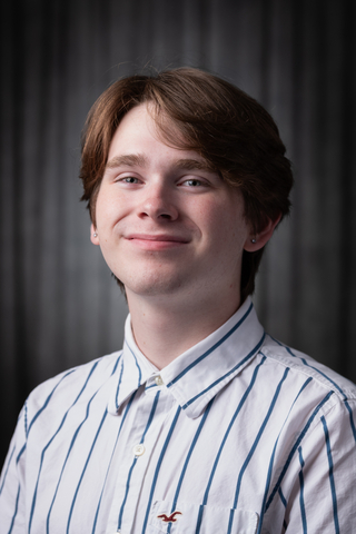 Professional headshot of SGA President