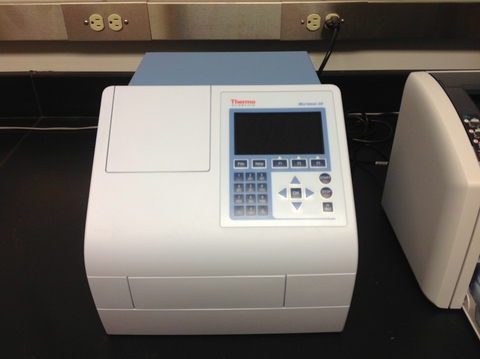 a UV-Visible microplate reader with a panel and screen on the front