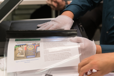 Person holding laminated documents