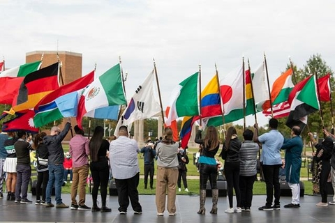 International Students holding their national flags.
