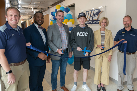 people about to cut the ribbon on the new eSports Arena