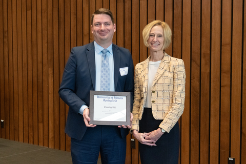 Timothy Bill with Chancellor Gooch and Tim's framed certificate for the 2025 Faculty Award for Diversity and Inclusion