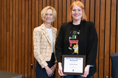 Allison Lacher with Chancellor Gooch and Allison's framed certificate for the 2025 Outstanding Teacher Award.