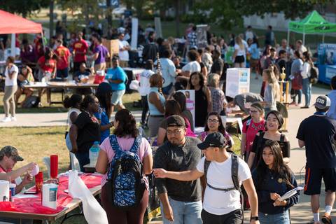 Students walking on the UIS Quad at the Involvement Expo 