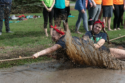 UIS students participating in mud tug-of-war