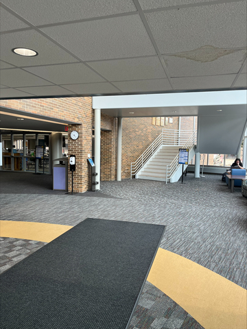 Stairs leading upwards next to the cafeteria just beyond the bookstore at ICC