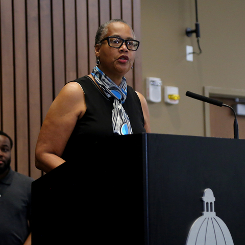 Donna Brown, Distinguished Volunteer Award recipient, speaking at Good as Gold Ceremony