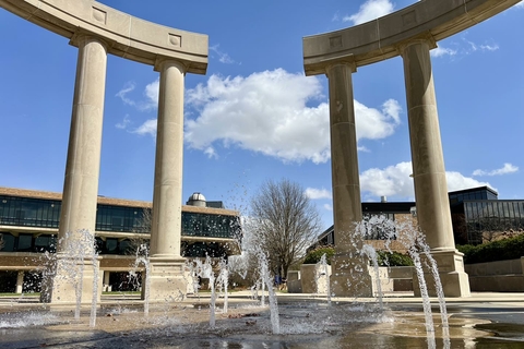 water fountain flowing in center of colonnade