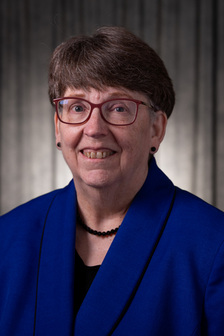 Cecilia Cornell head and shoulders photo in business attire