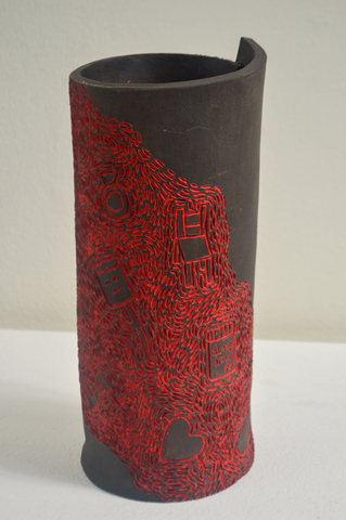 ceramic vase with red etchings