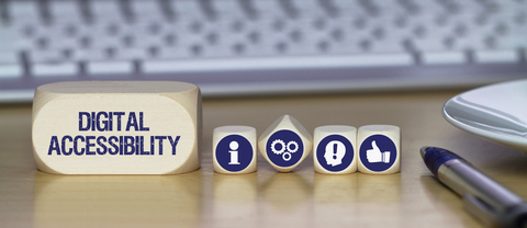 wooden blocks with words "digital accessibility" in front of a keyboard, mouse, and pen.