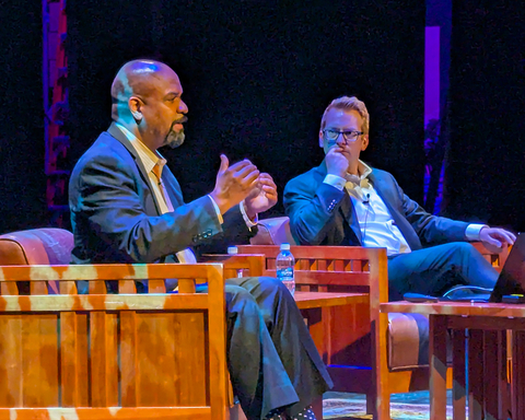 Jacob Friefeld sits with Dan Duster during the question and answer session