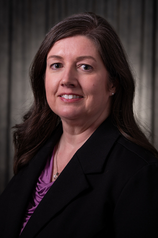 Michele Gribbins head-and-shoulders photo in business attire
