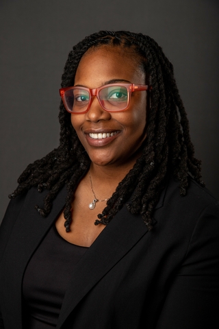 Professional headshot of Marie Watson wearing a black blazer.