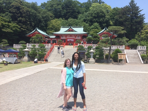 students posing outside of a Japanese building