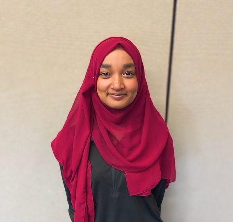 SOFA Records Keeper, Minnah Saleh, smiling.