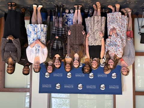 Graduates of the School of Education standing together in a group photo.