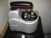 a scanning probe microscope, with a rotating tray for samples