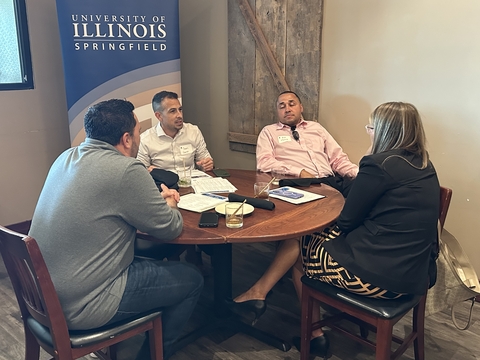 four people converse at a UIS Professionals Networking event