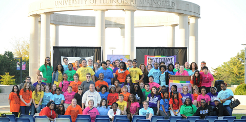 Queertober participants posing in front of the colonnade.