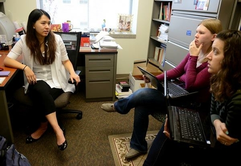 Students discussing with Professor.