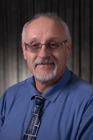 Mike Roth head-and-shoulders photo in business attire