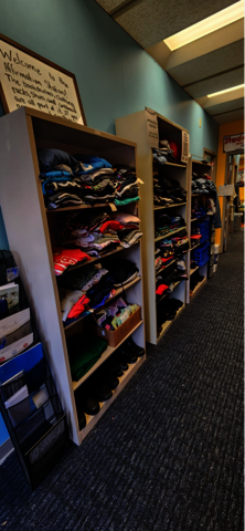 Shelf of folded clothes.