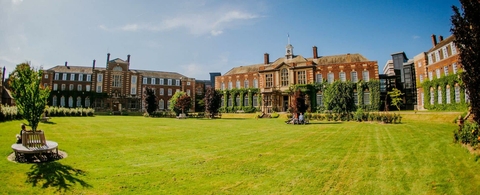 University of Hull in England, large green space between old brick buildings