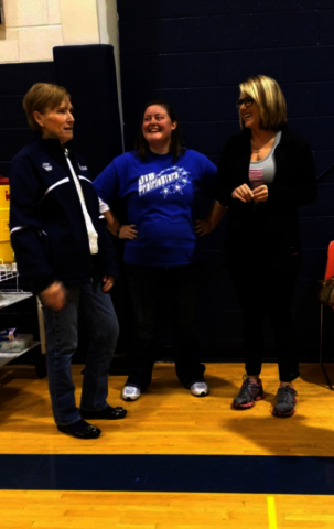 Dana Goodrum talking to others at a UIS sports game.