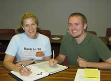 a male and female student studying