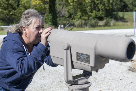 UIS employee at a telescope